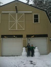 Click to view larger image of the snowmen outside Cowboy Gunworks.