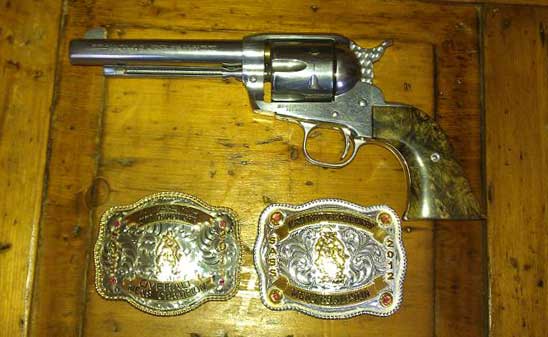 Pistol made for Four Bucks from Alaska and the buckles it helped win.